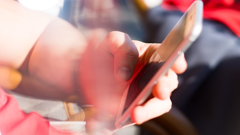 Close-up of person using an iPhone