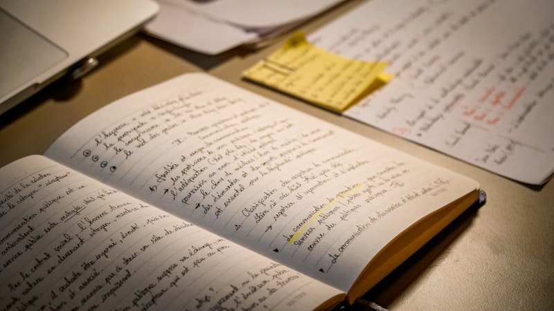 Open notebook filled with handwritten text and notes