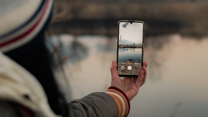 Person taking a photo with their smartphone
